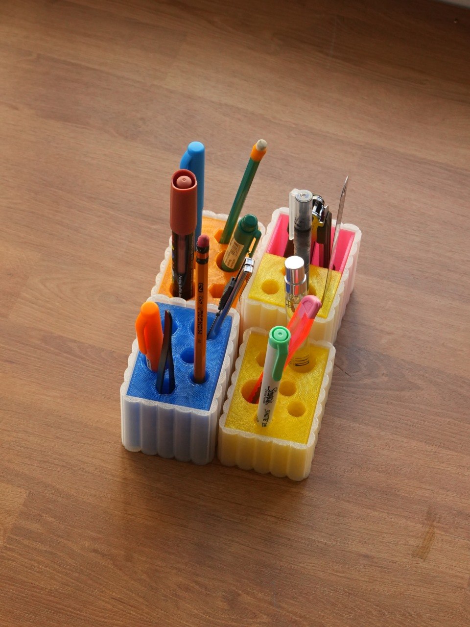 Set of 3D printed desk essentials holding various pens and pencils