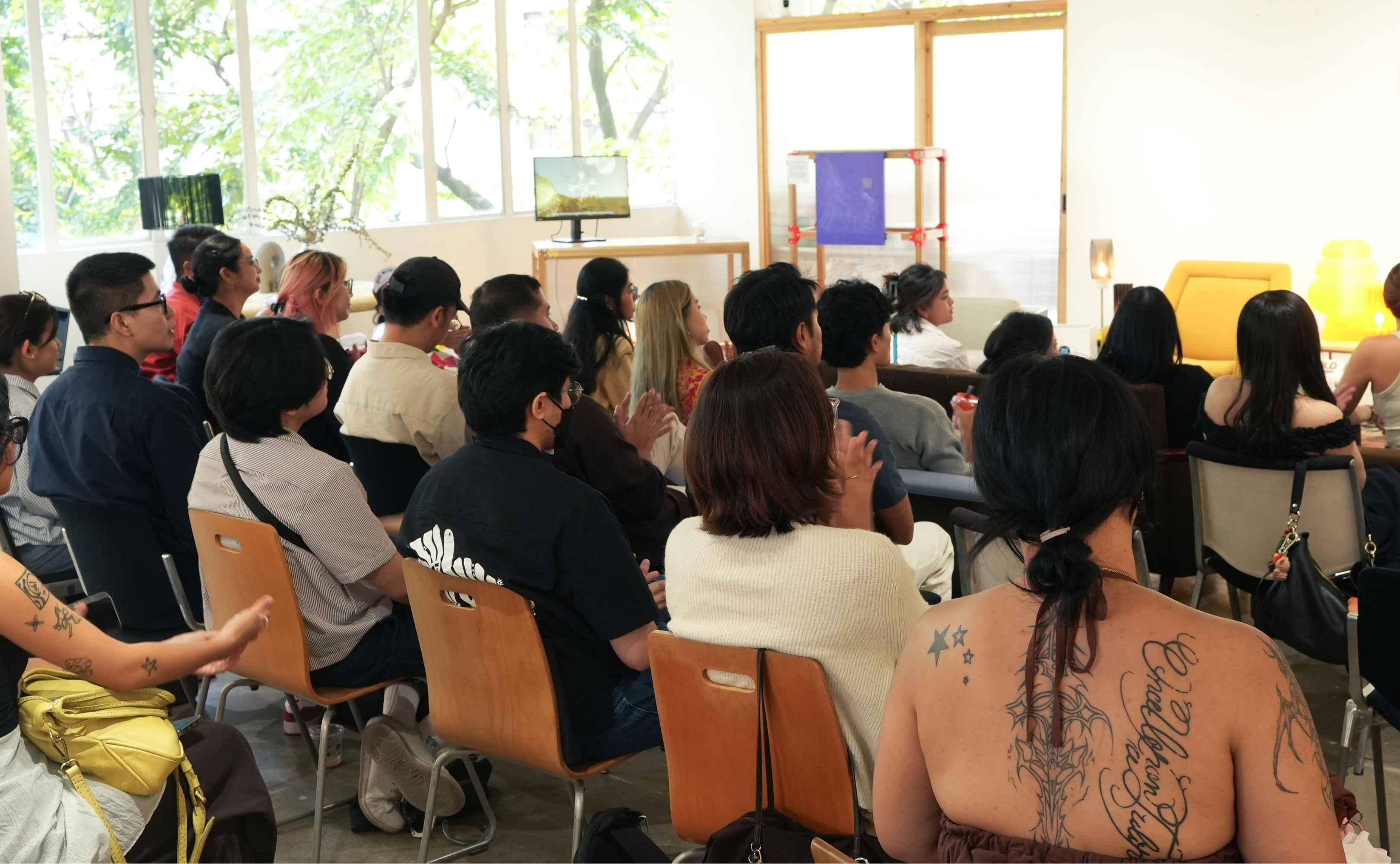 An audience watching a presentation.