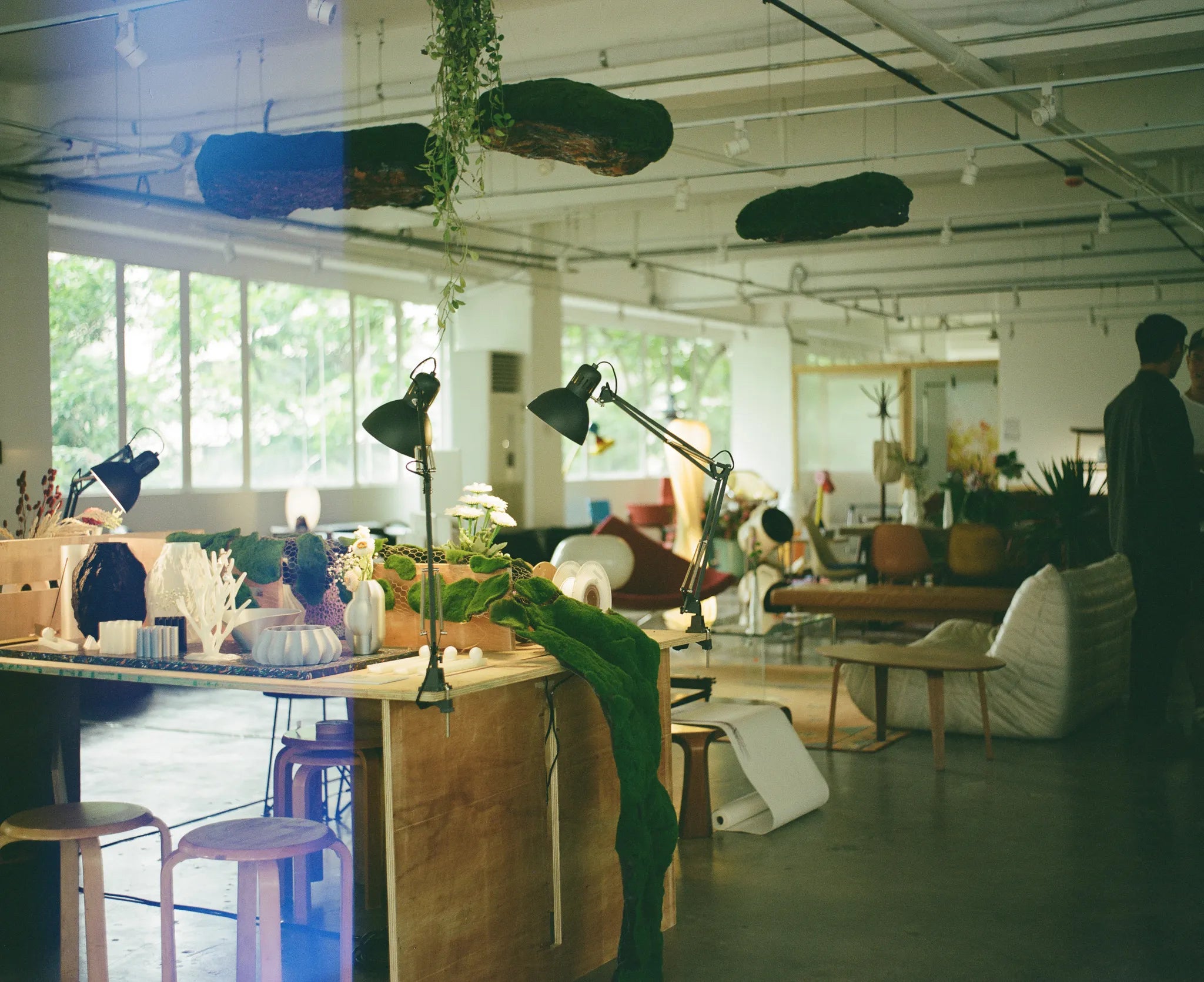 Design studio and maker space with desks, chairs, and decorations.